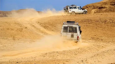 Hurghada dune buggy tour - driving through desert landscape